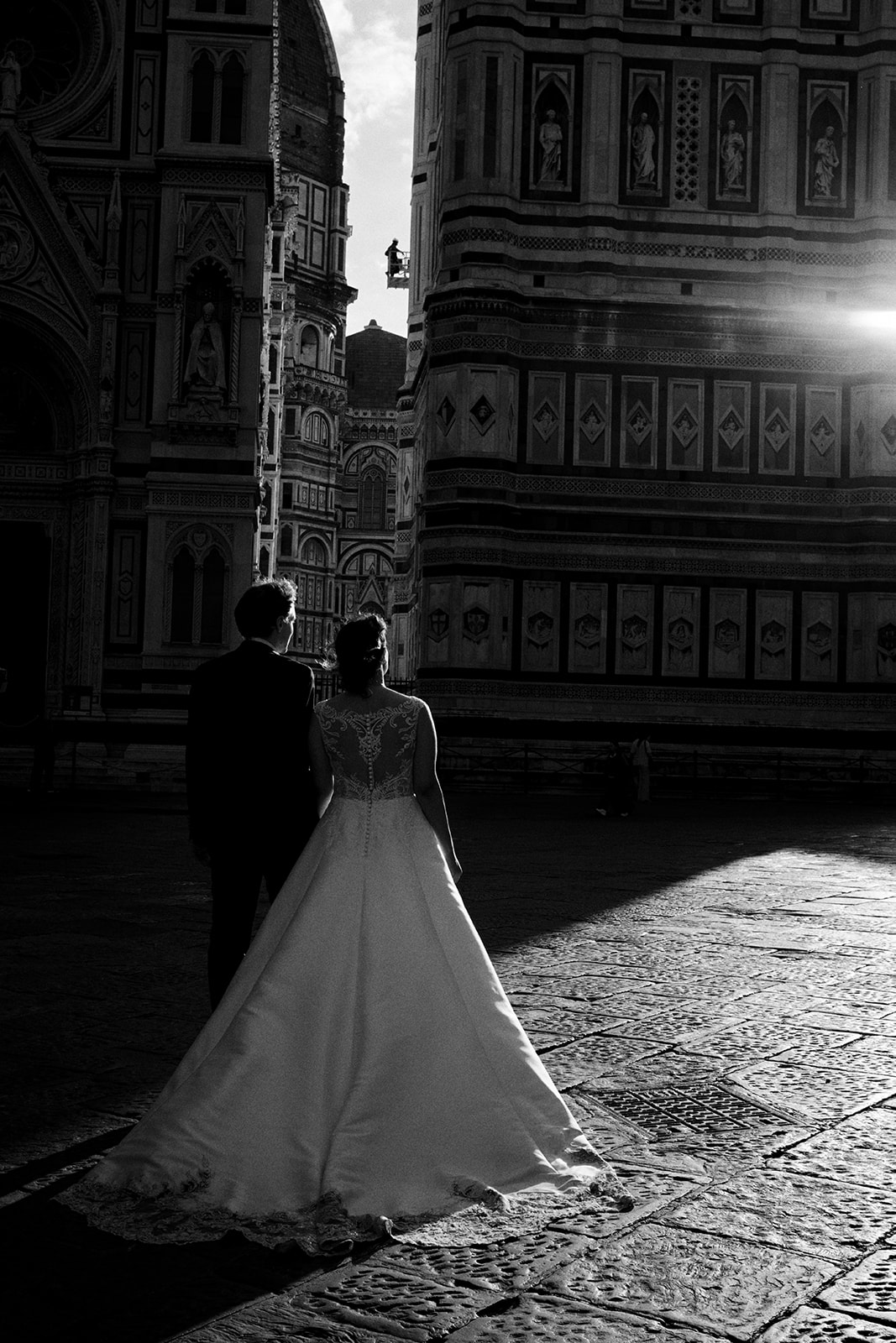 Couple walking near the Florence Duomo at sunrise