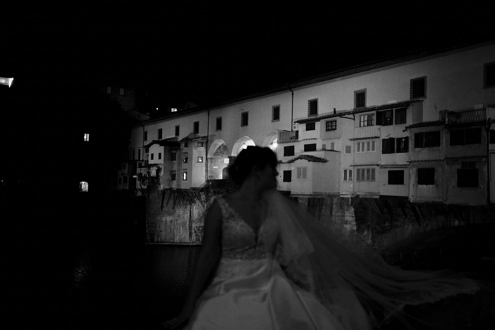 Bride and groom by the Arno at blue hour in Florence