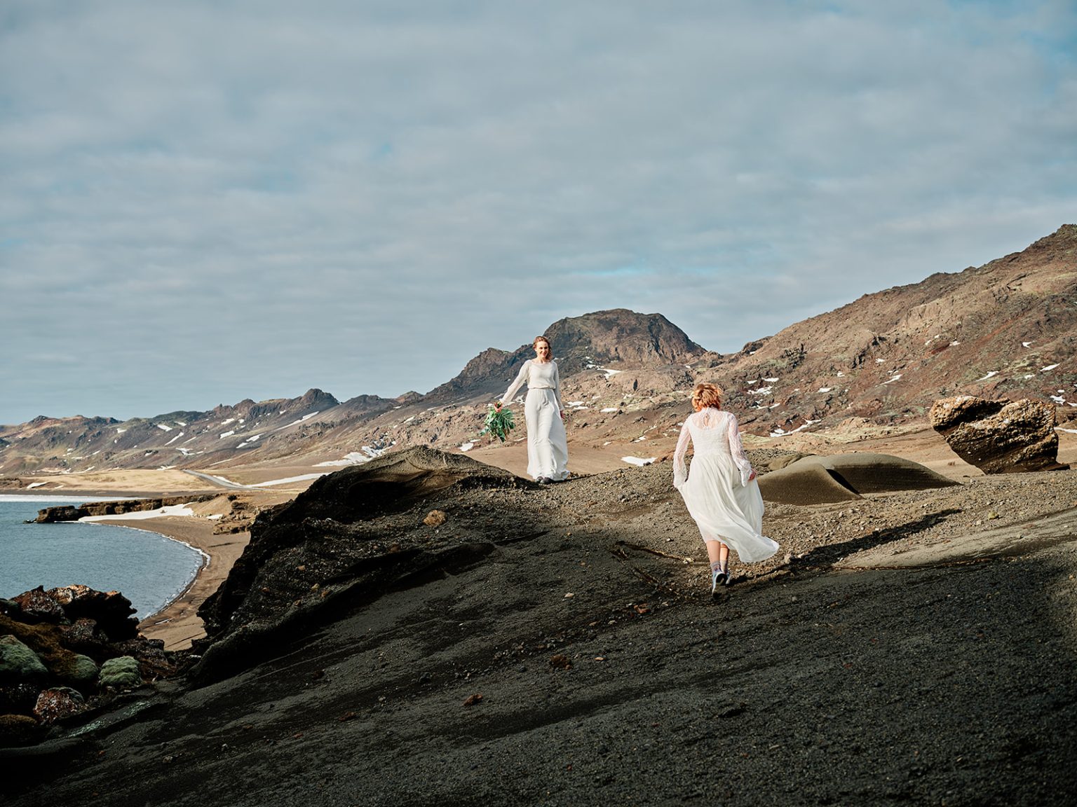 A bride on the black lava coast, Reykjanes, Iceland
