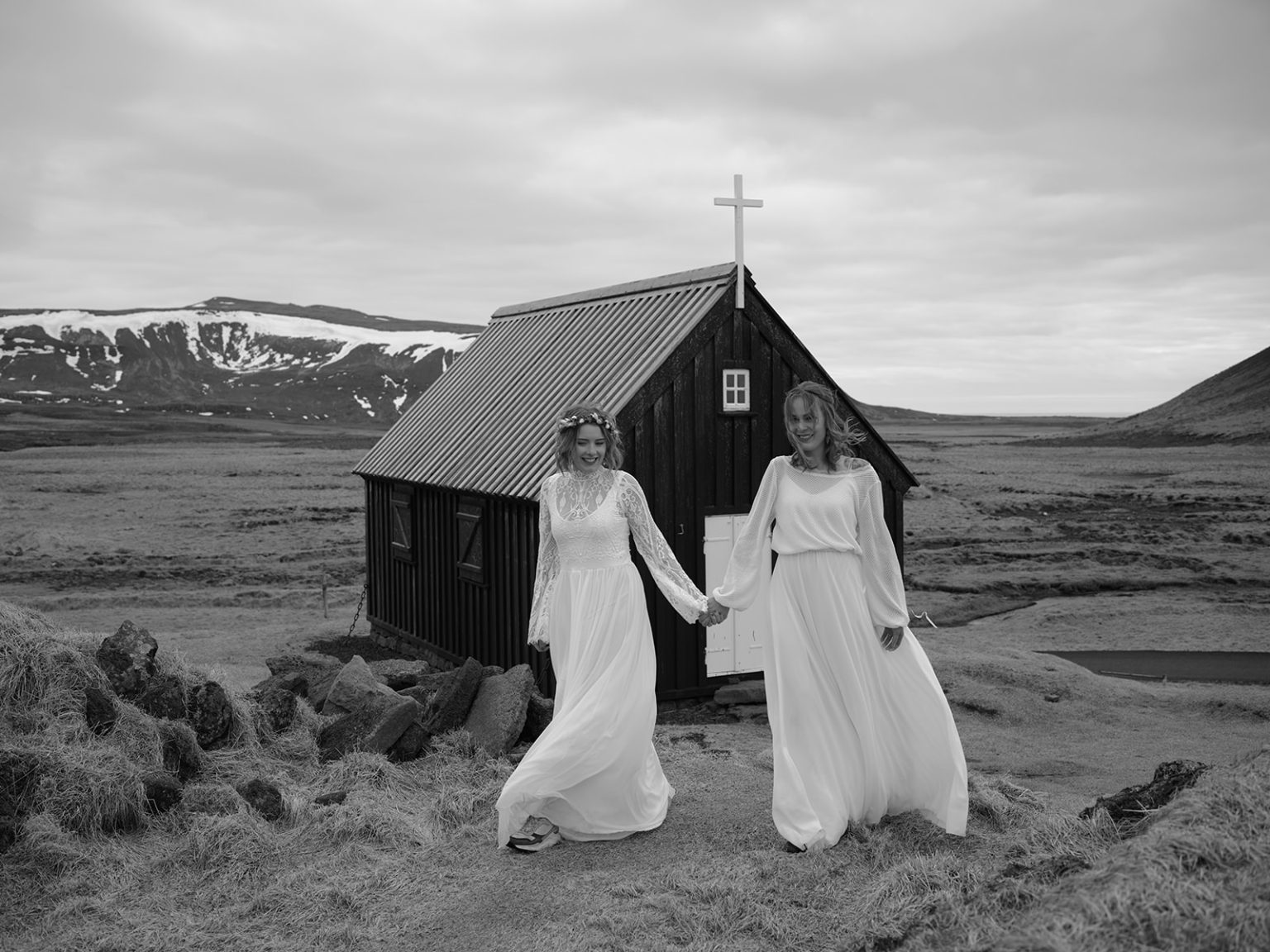 Glóþór and Sólveig walking from the black church, Reykjanes