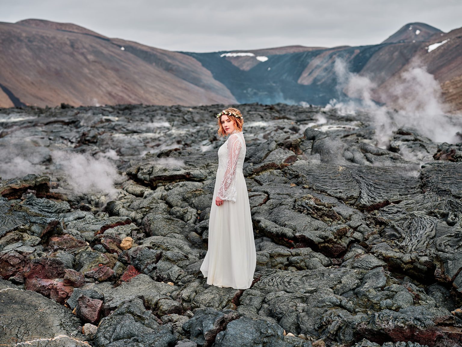 A bride in the geothermal steam of Reykjanes, Iceland