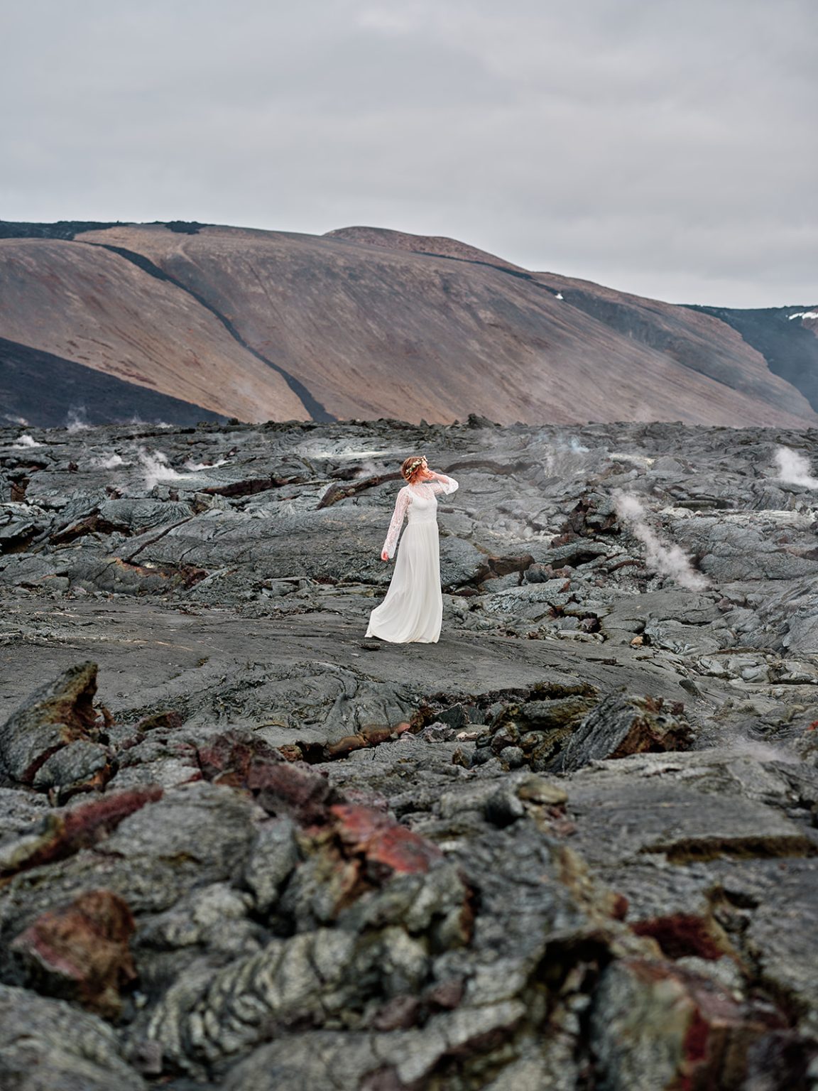 A bride small in the vast Reykjanes lava, a gay elopement in Iceland