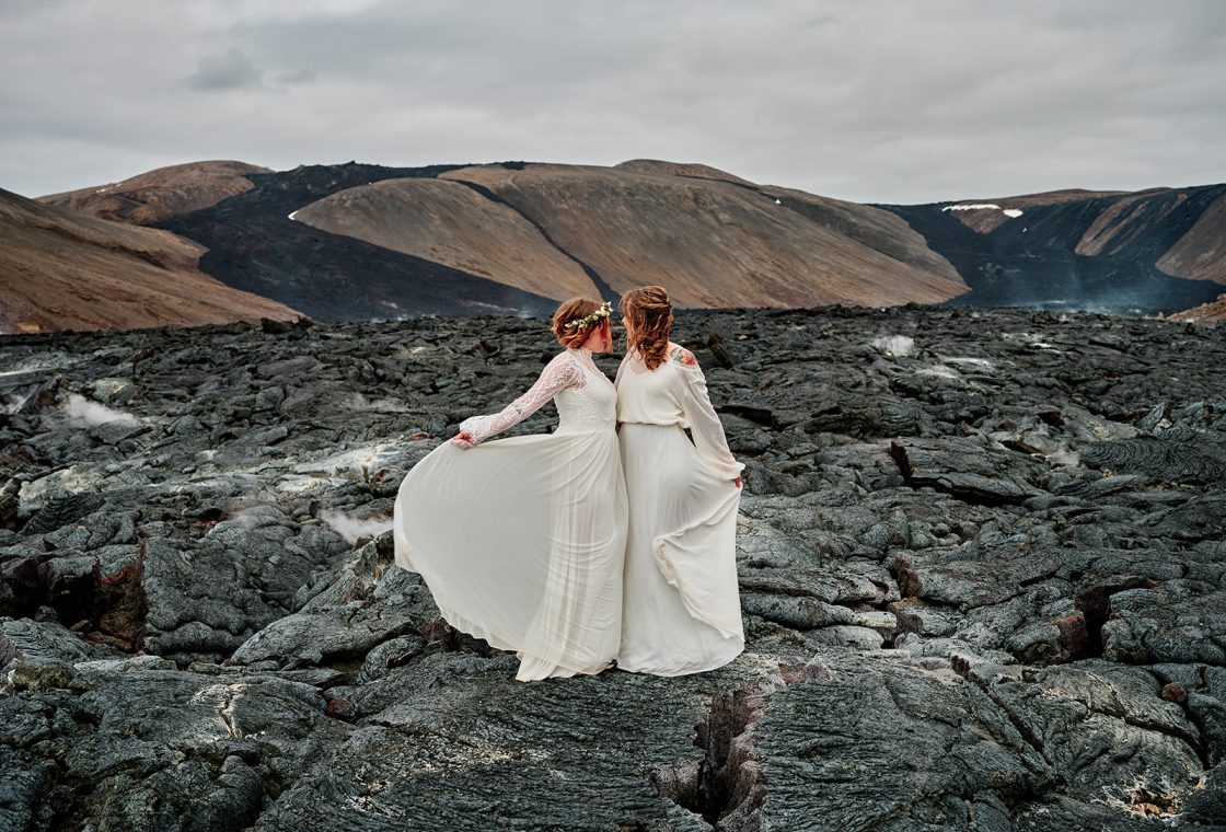 Two brides in the lava with mountains behind, Reykjanes, Iceland