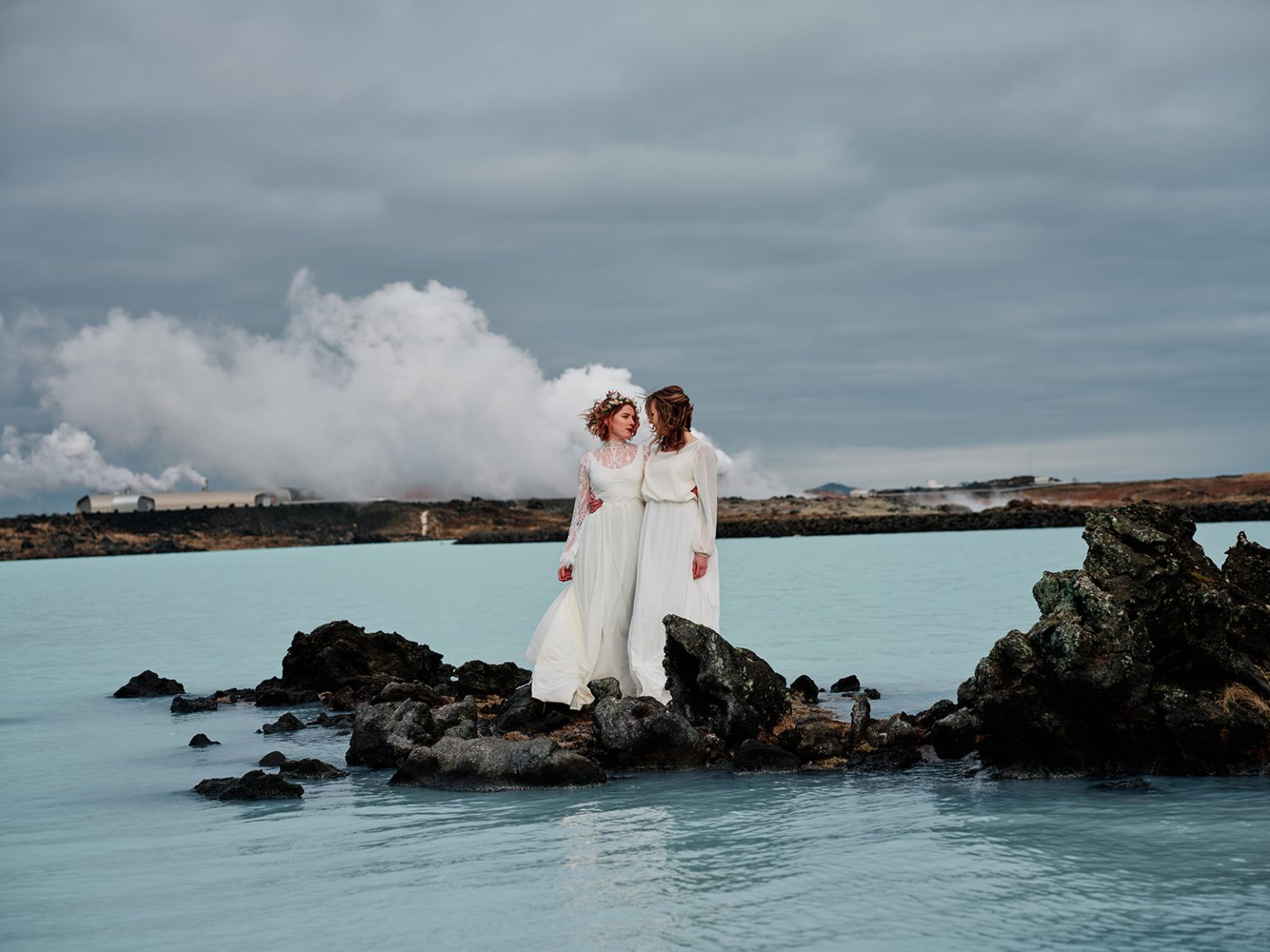 The brides by geothermal steam and blue water, gay elopement in Iceland
