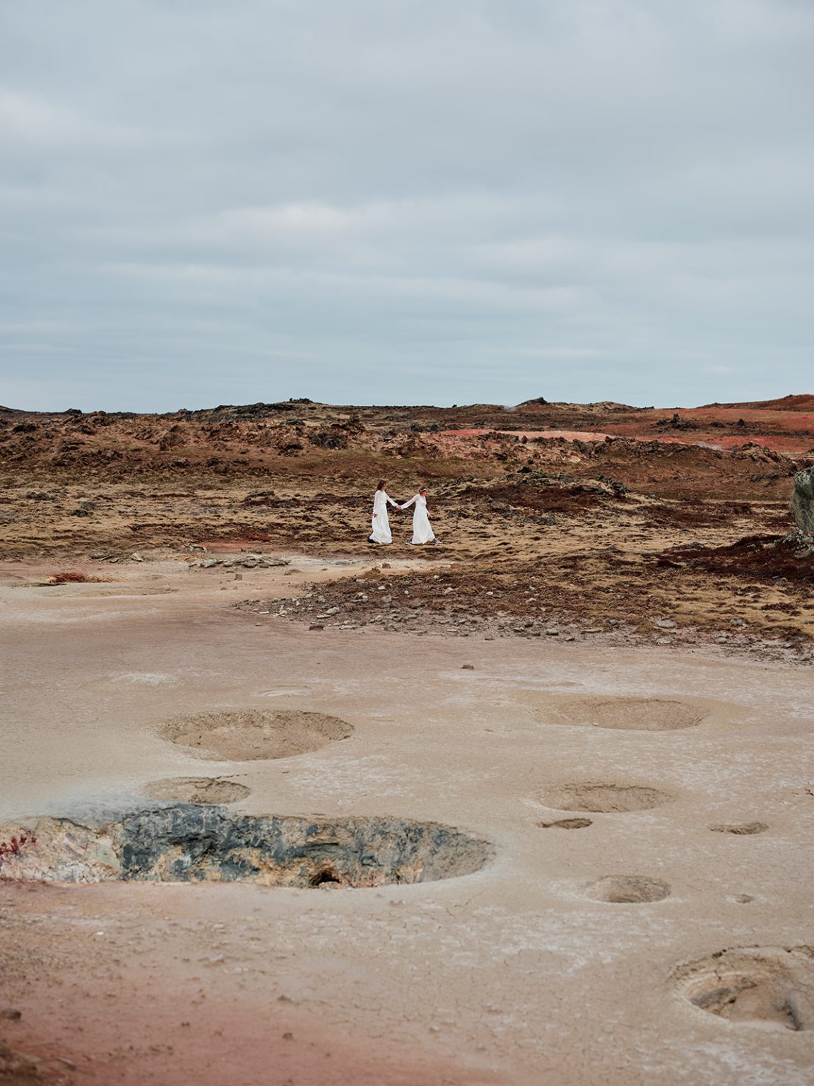 Glóþór and Sólveig tiny in the Reykjanes landscape, Iceland