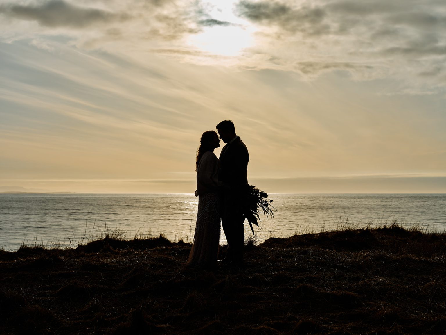 An embrace in silhouette against the Iceland dawn, Snæfellsnes
