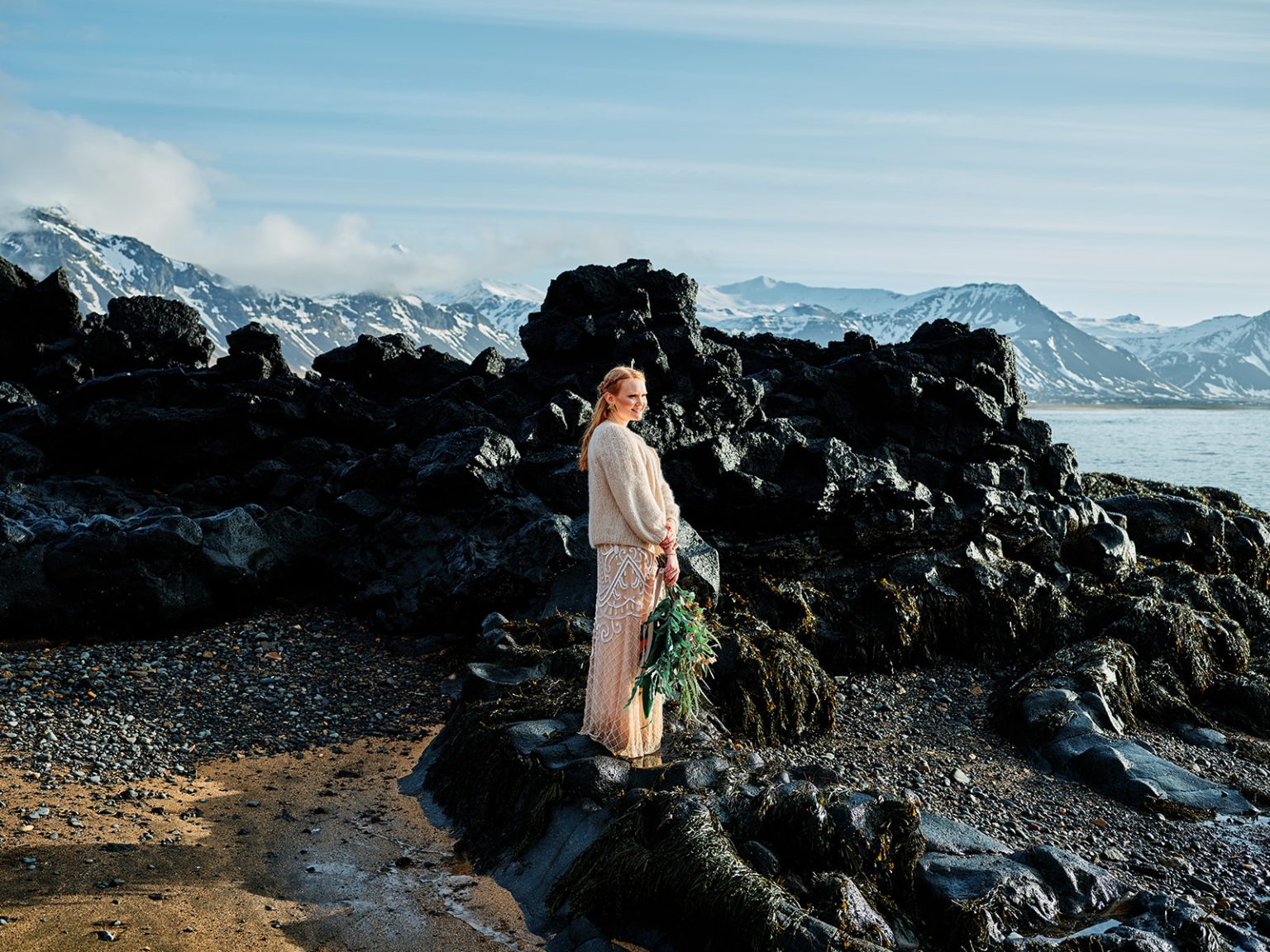 Black lava and snowy peaks on the Snæfellsnes coast, Iceland