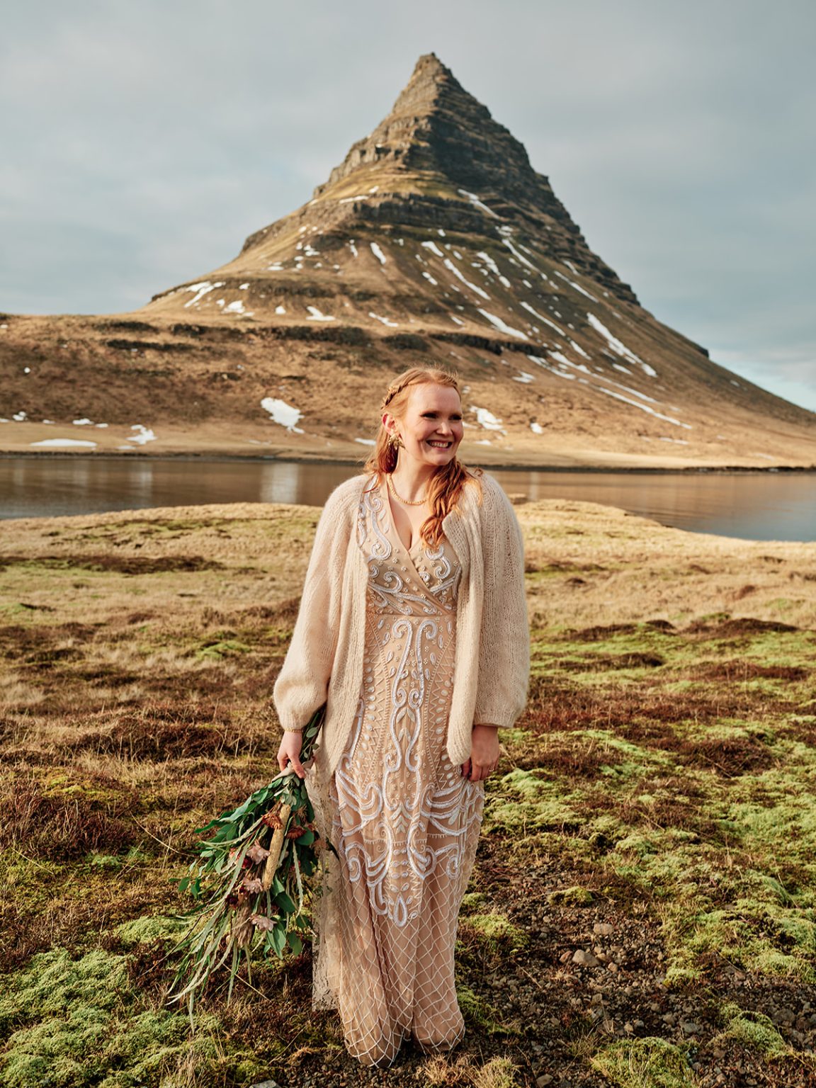 The bride below Kirkjufell, Snæfellsnes, a Hótel Búðir elopement