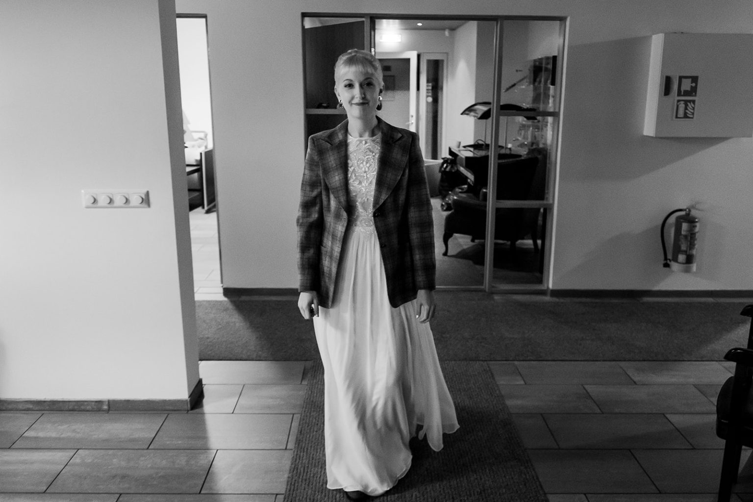 Bride at the lodge before her Hvalfjörður wedding on the darkest day of the year