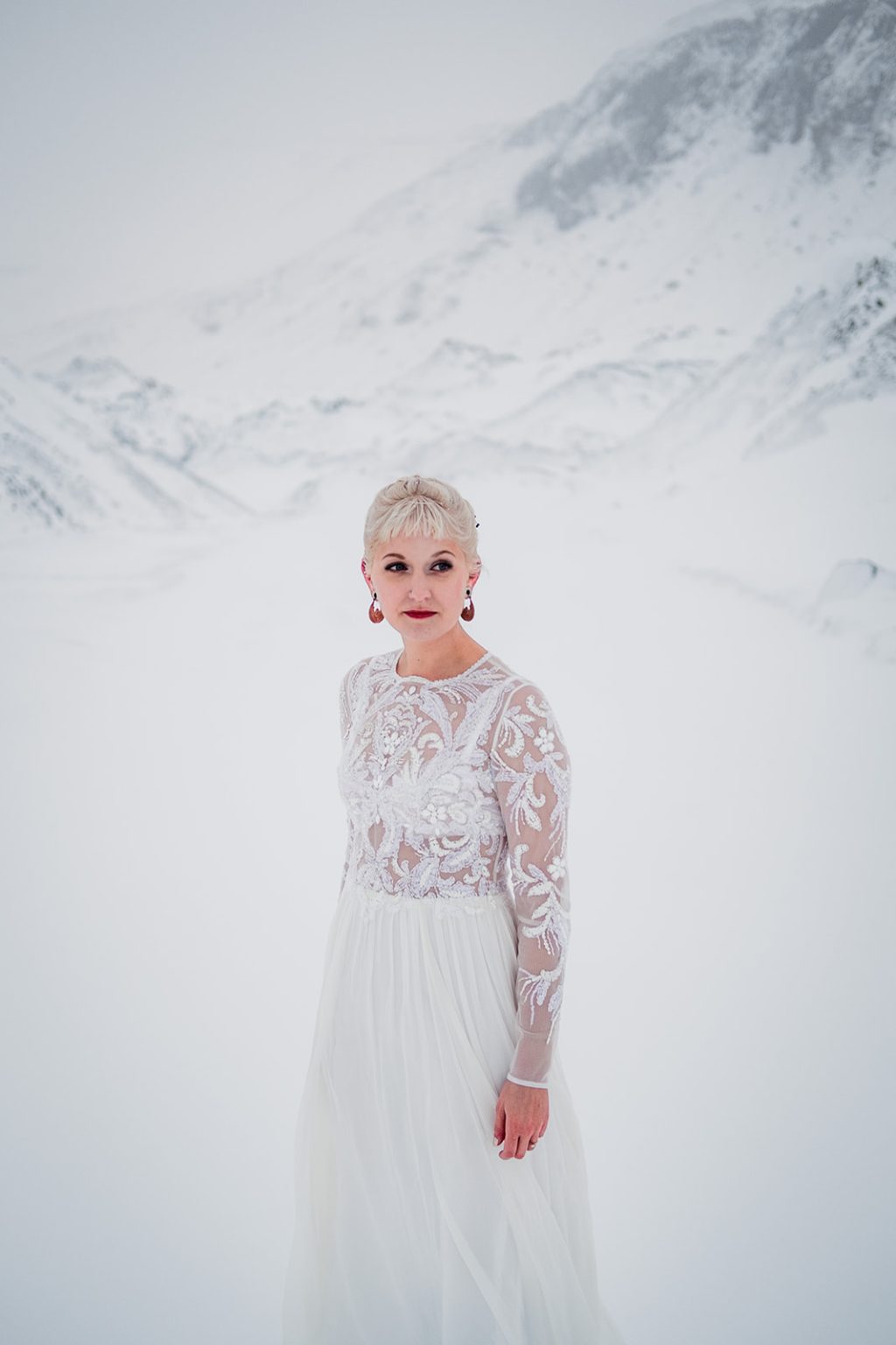 Winter bride portrait in the mountains of Hvalfjörður