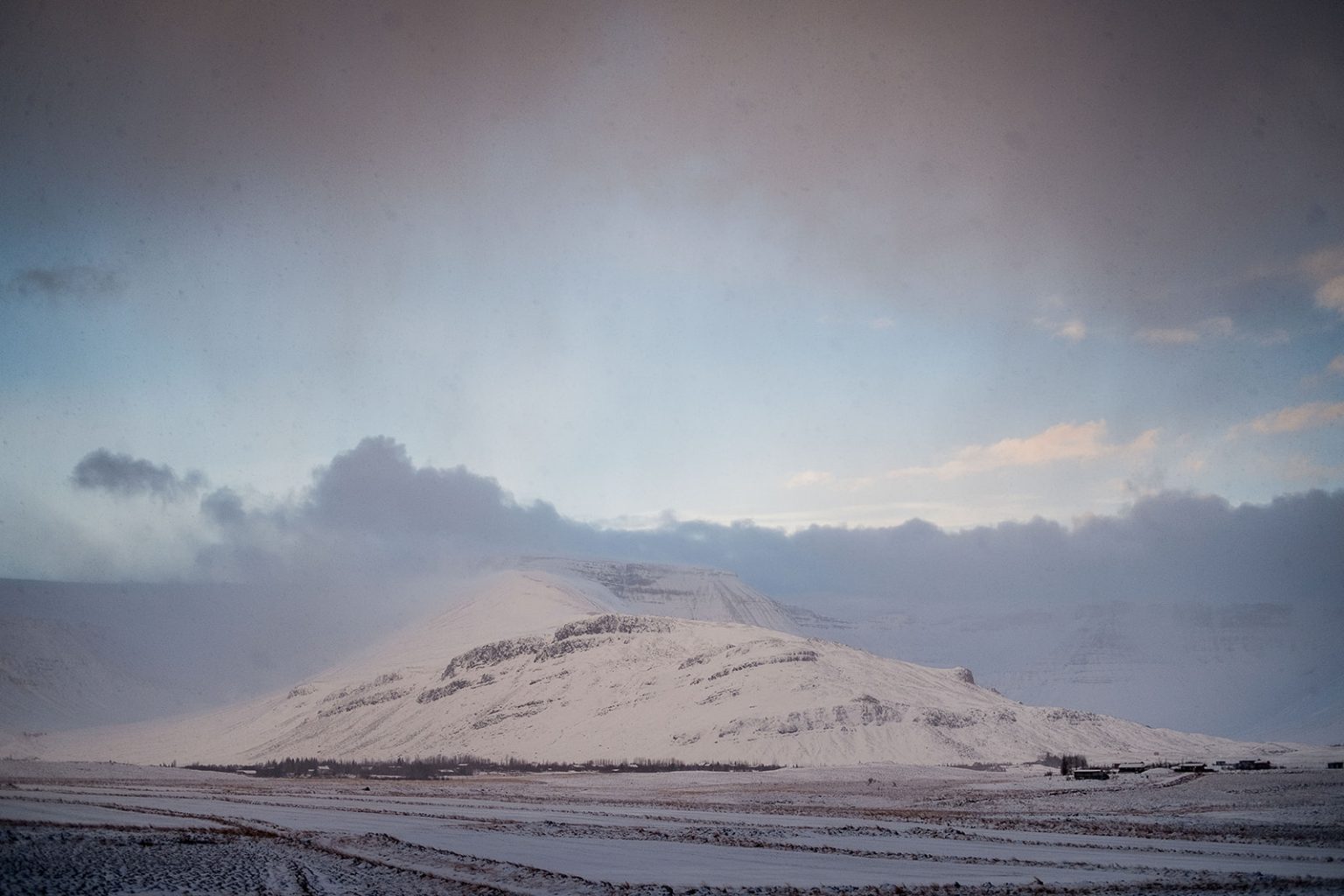 Hvalfjörður fjord ringed by snowy mountains in winter