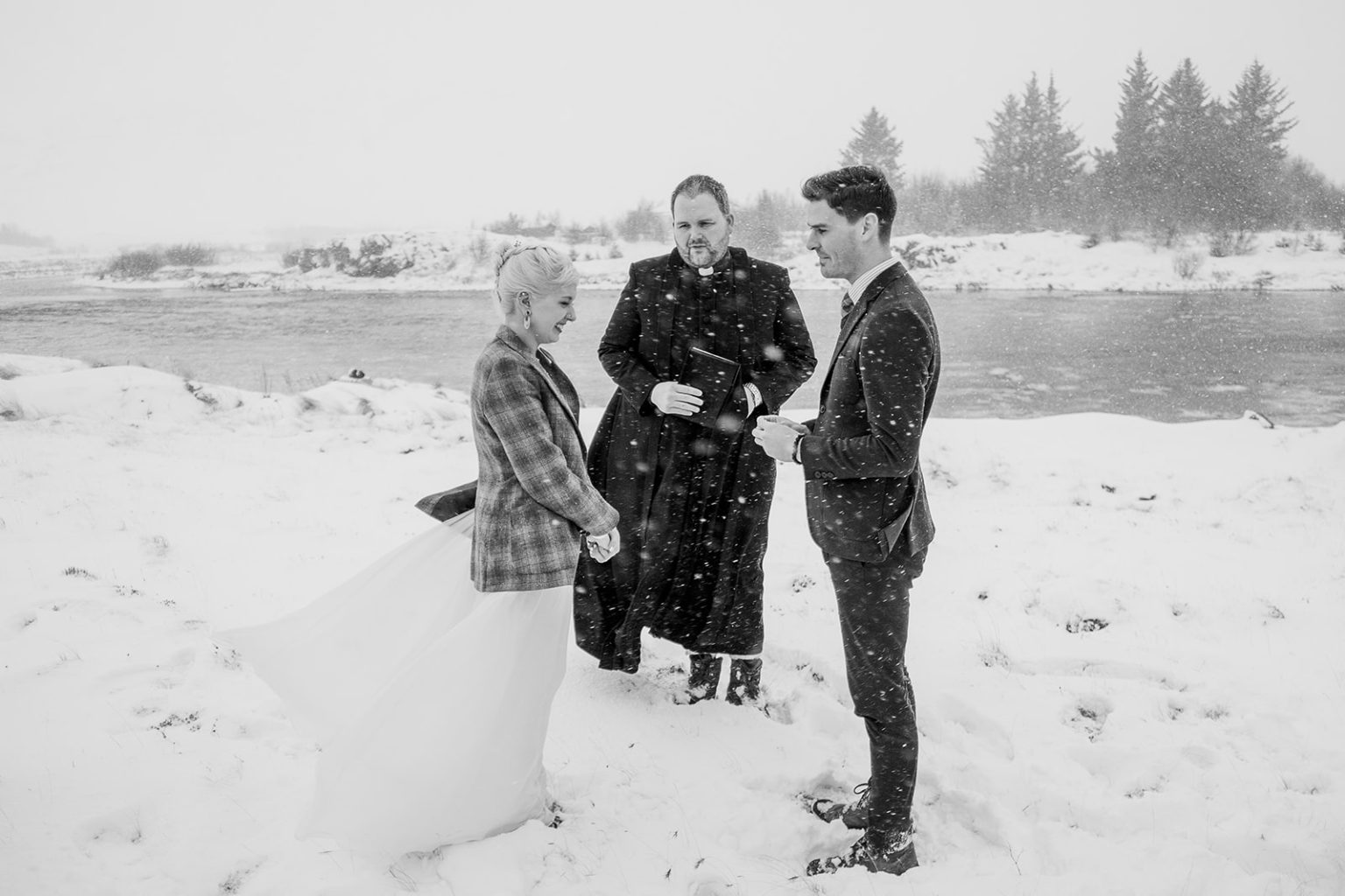 Guests watching the ceremony in the snow in Hvalfjörður