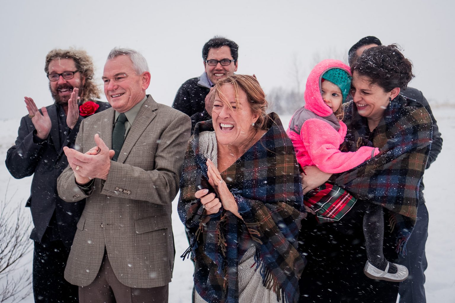 Guests applauding after the ceremony in the cold