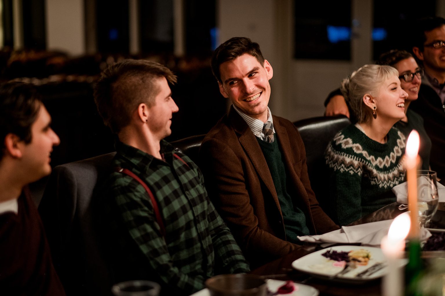 Guests during speeches at the candlelit wedding dinner