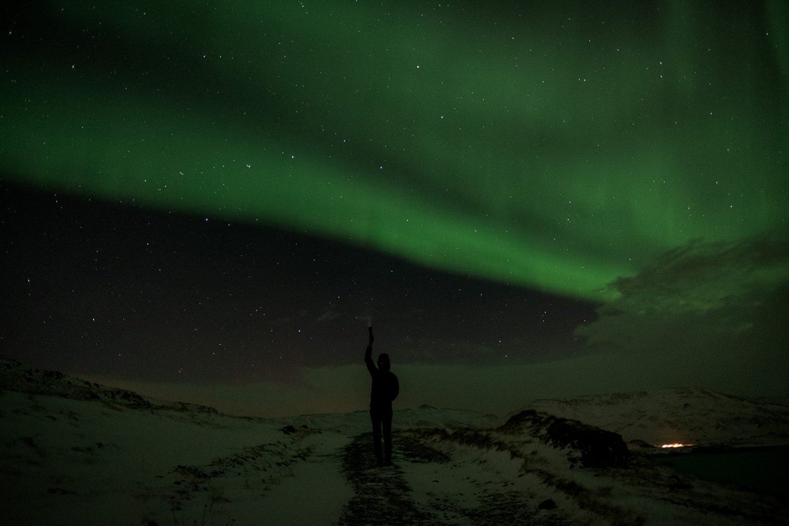 A guest under the northern lights on the darkest night of the year