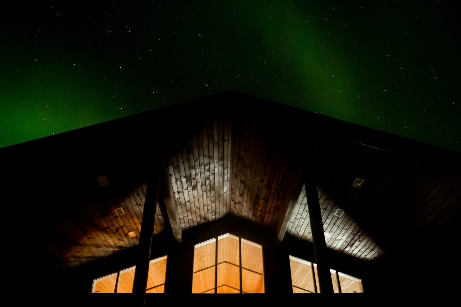 The aurora over the venue at the end of an Iceland winter wedding