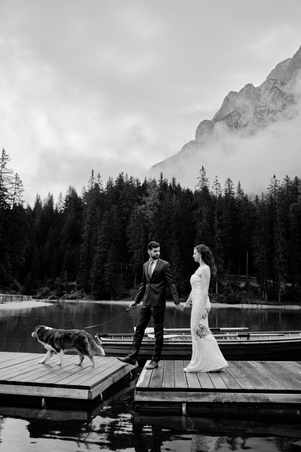 Simona and Marius by the misty lake at dawn, Lago di Braies elopement