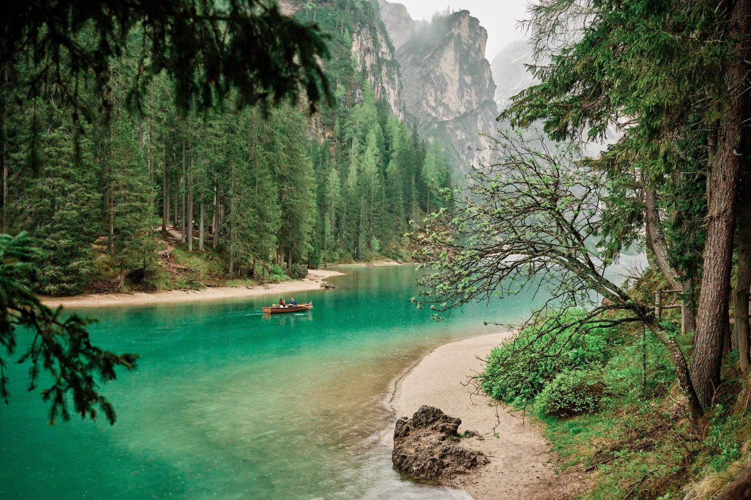 The green lake and forest of Lago di Braies, Italy