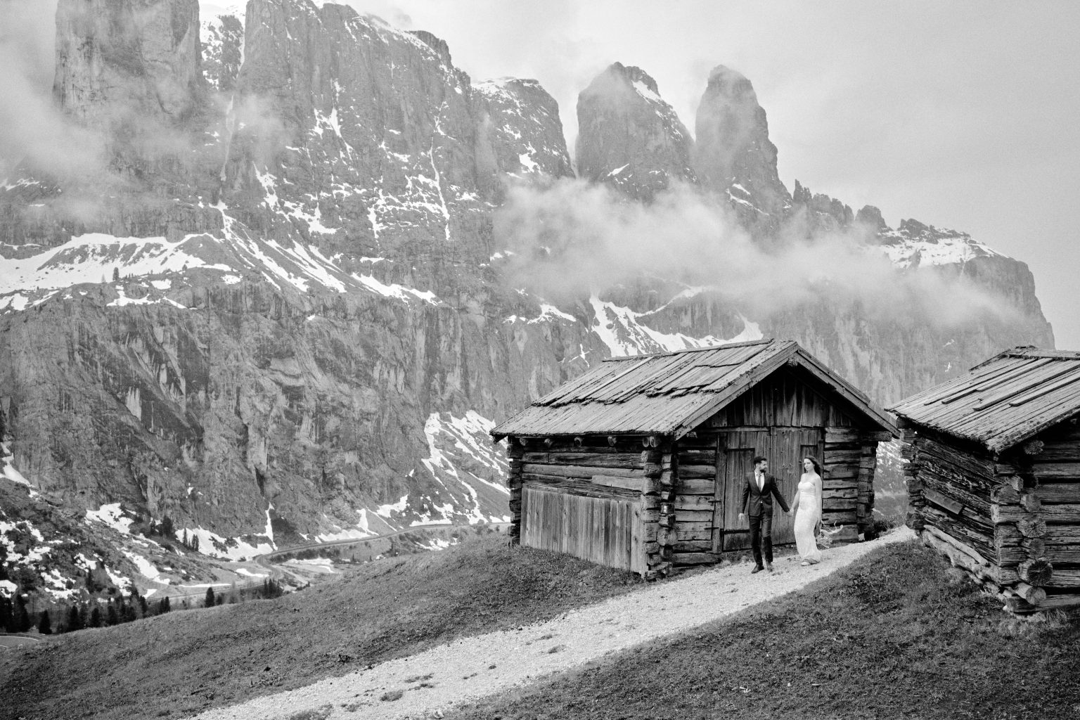 An alpine hut below misty peaks, Dolomites