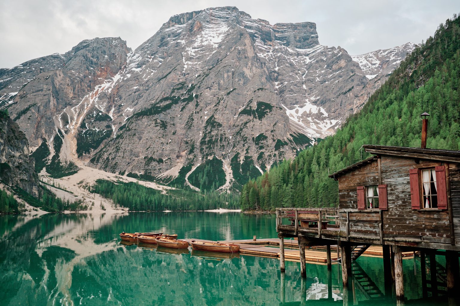The wooden boathouse at Lago di Braies, Dolomites