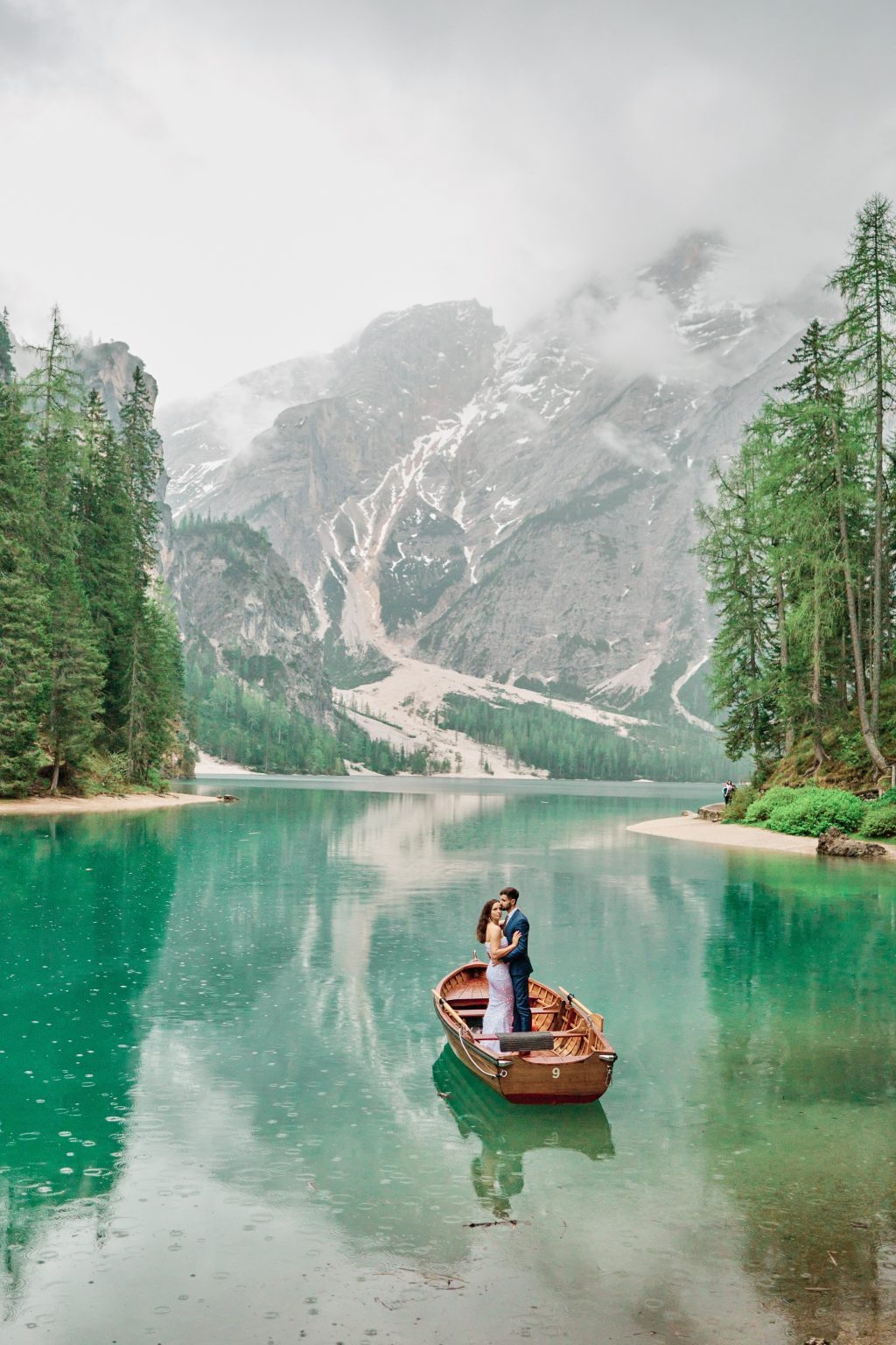 Simona and Marius at the edge of Lago di Braies, Dolomites