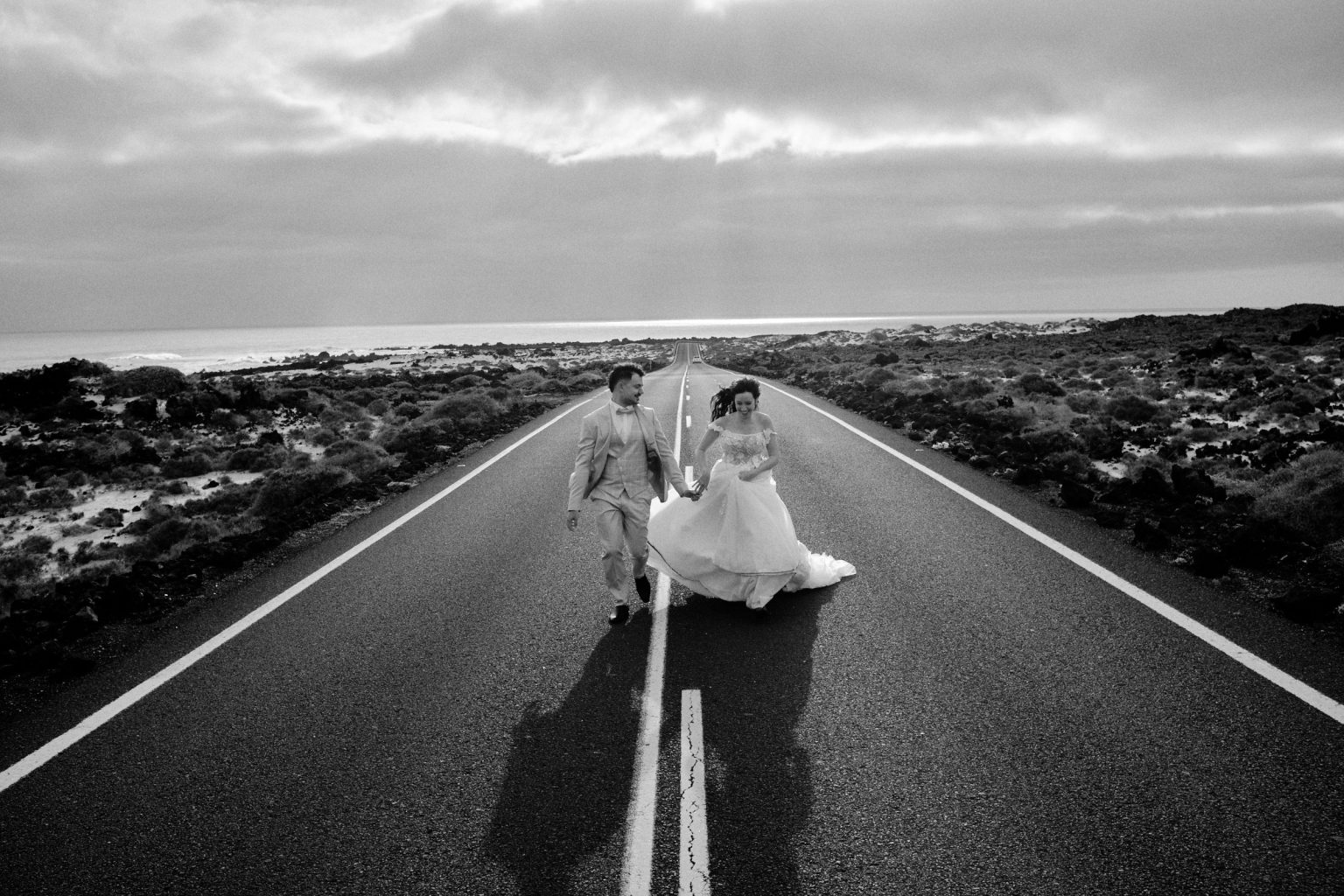 Couple on an empty Lanzarote road, black and white