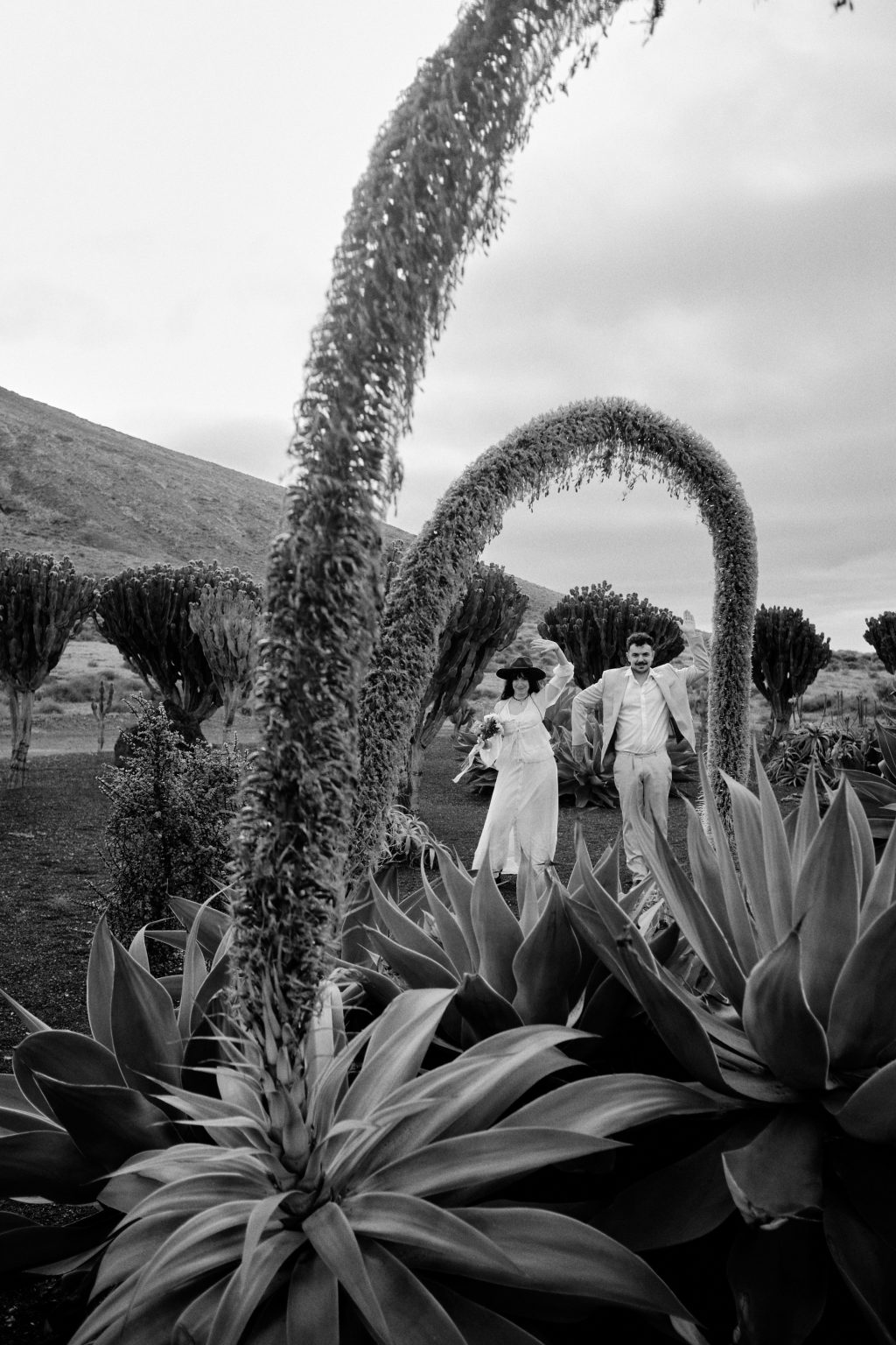 Couple framed by cacti, black and white, Lanzarote