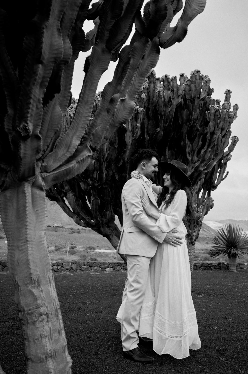 Couple embracing among the cacti, Lanzarote engagement session