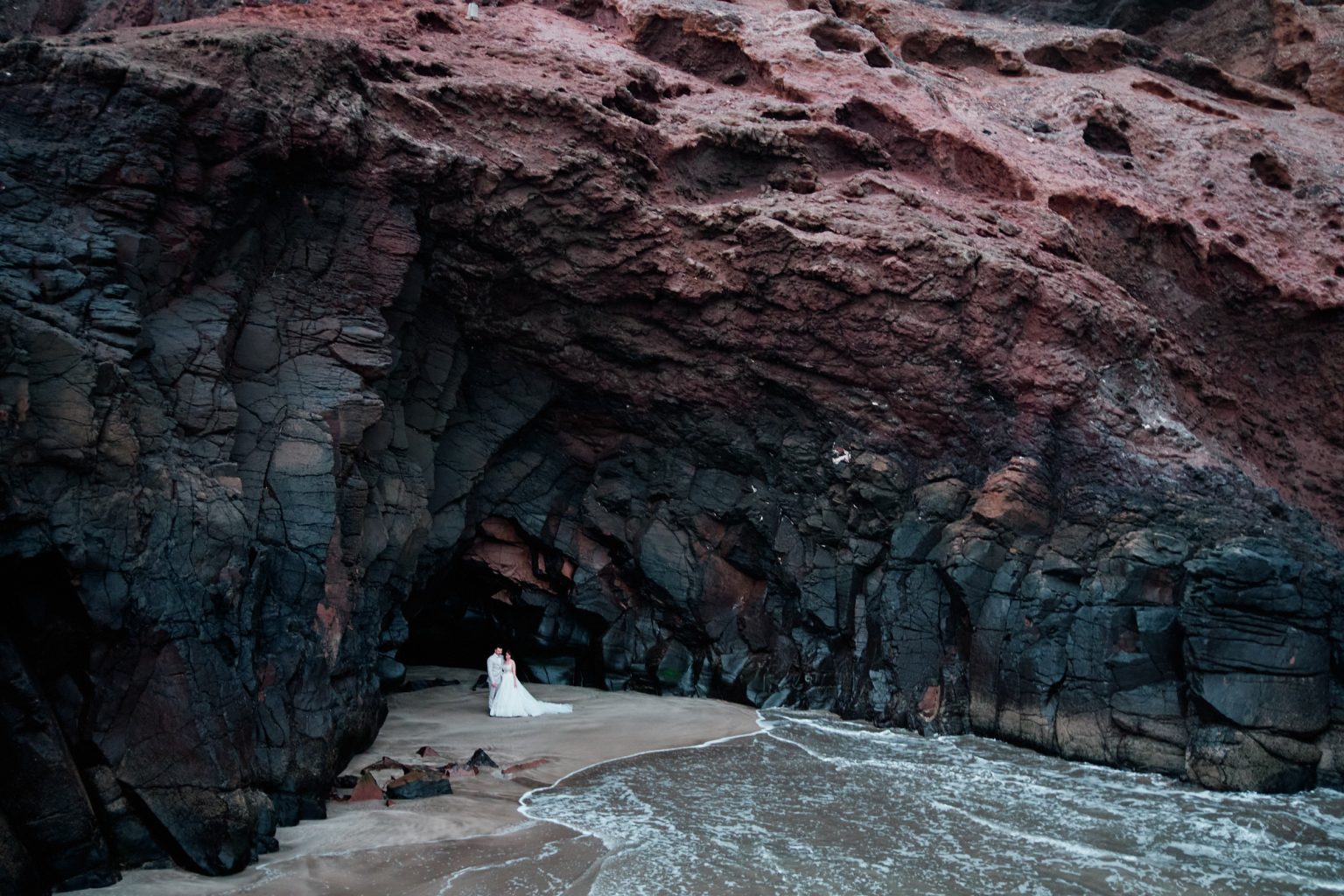 Red volcanic sea cave on the Lanzarote coast