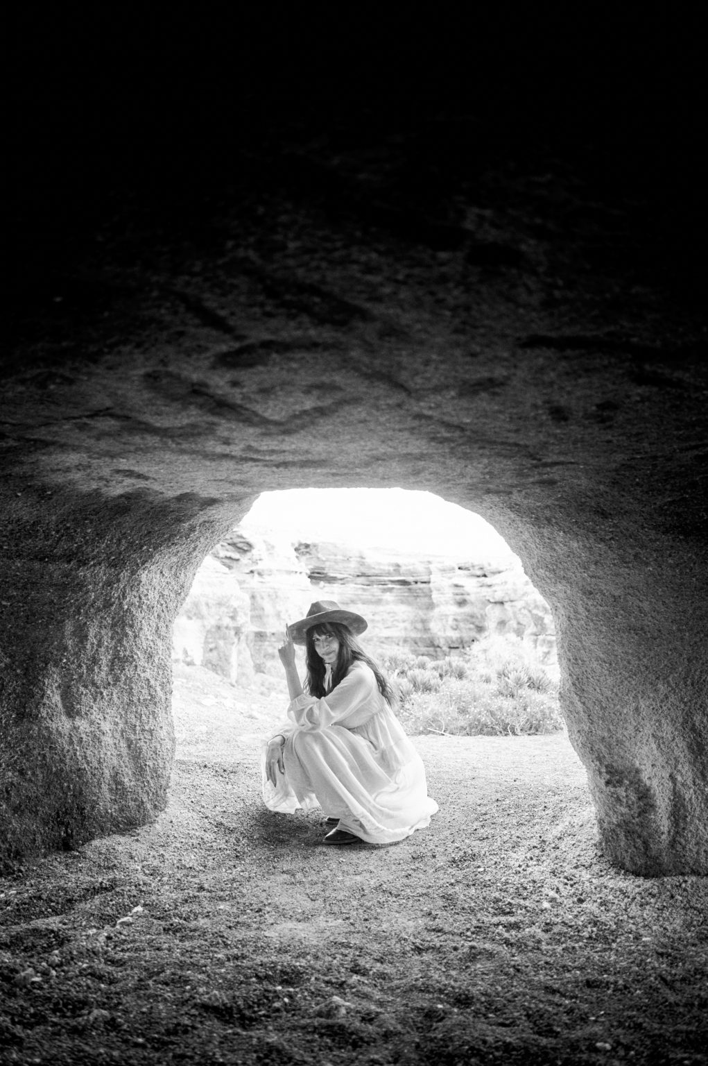 A figure in a lava cave opening, black and white, Lanzarote