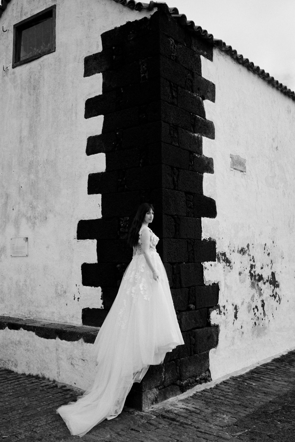 Bride in a dark doorway of a white wall, Lanzarote