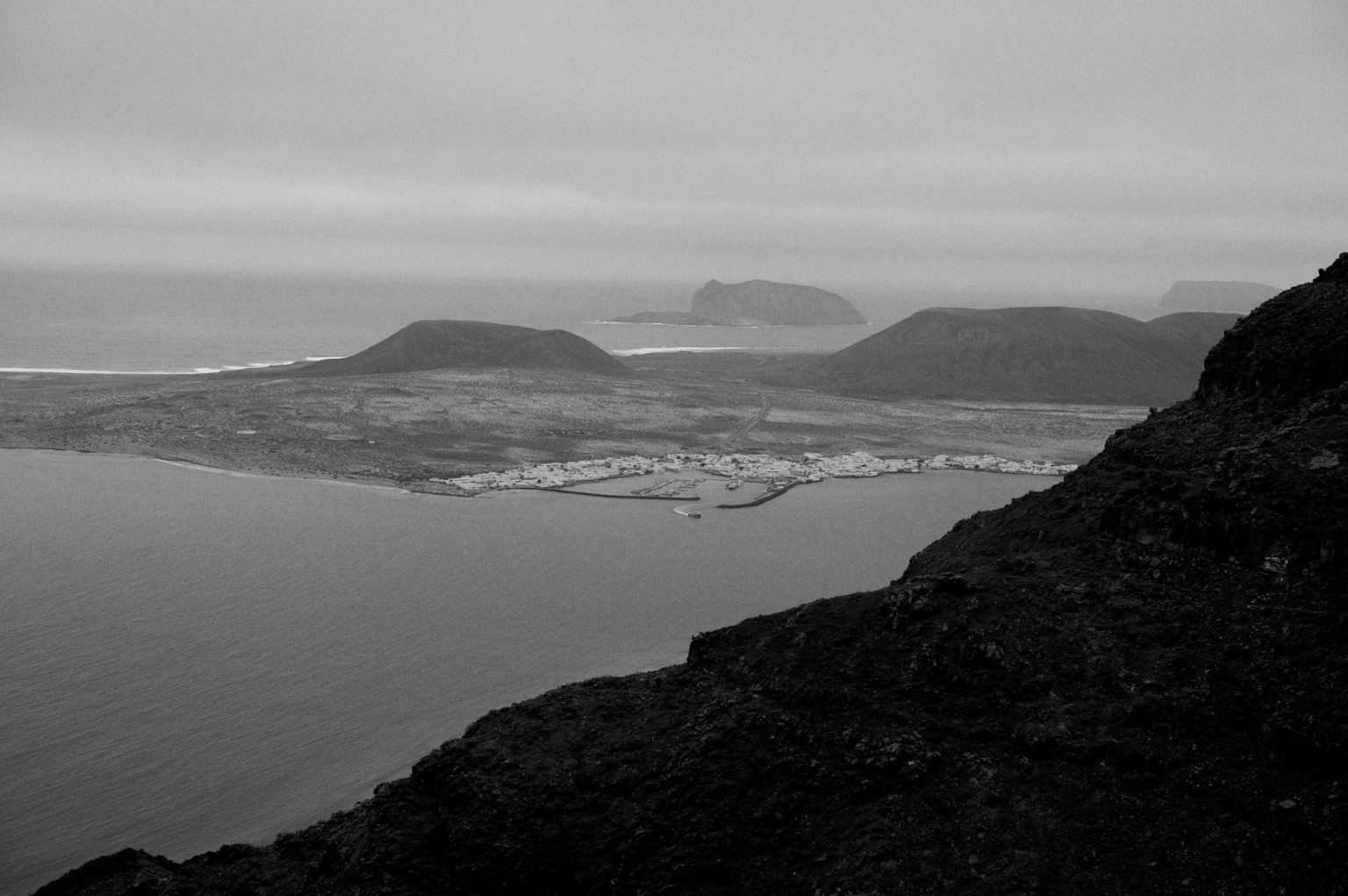 Clifftop view over the bay, black and white, Lanzarote