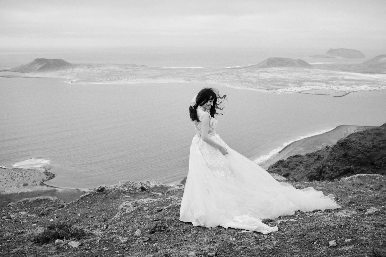 Bride on the clifftop in the wind, black and white, Lanzarote
