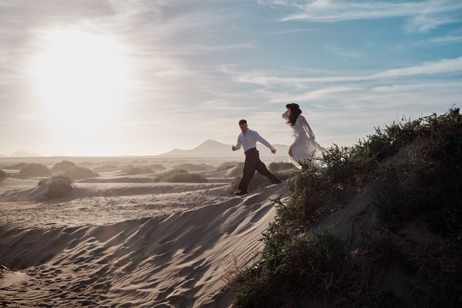 Francesca and Riccardo walking the dunes, black and white, Lanzarote