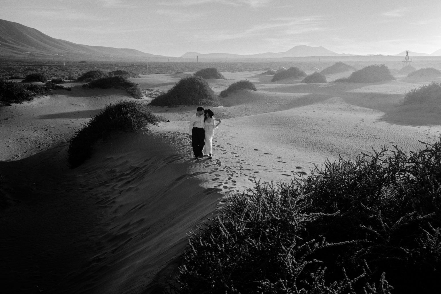 Walking the dune grass, black and white, Lanzarote