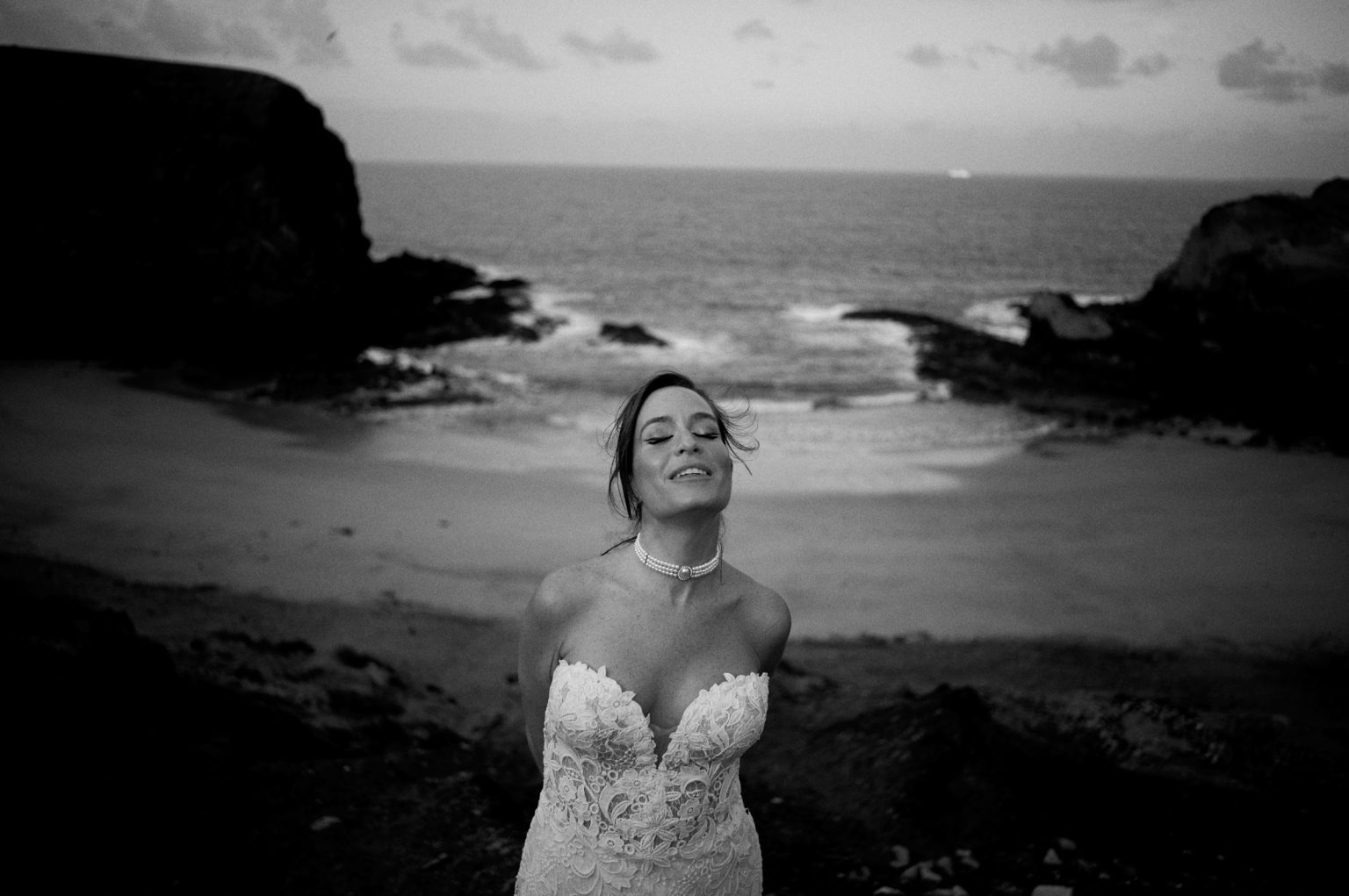 Bride on the rocky coast, black and white, Lanzarote