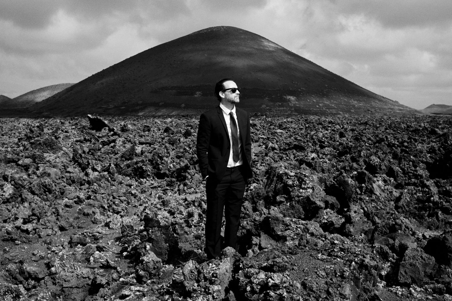 Groom alone in the lava fields, Lanzarote wedding photographer