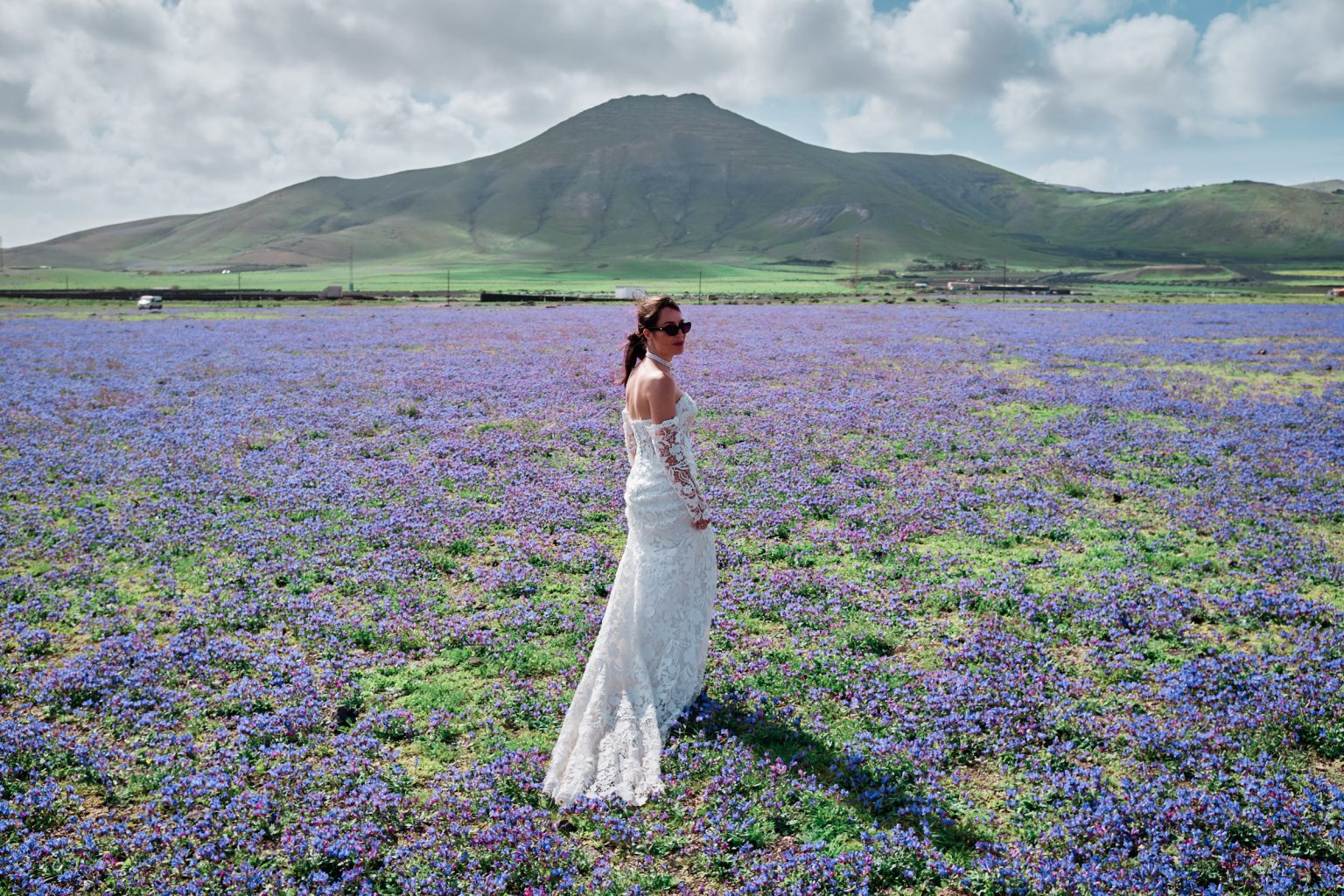 Bride in a field of purple wildflowers, Lanzarote
