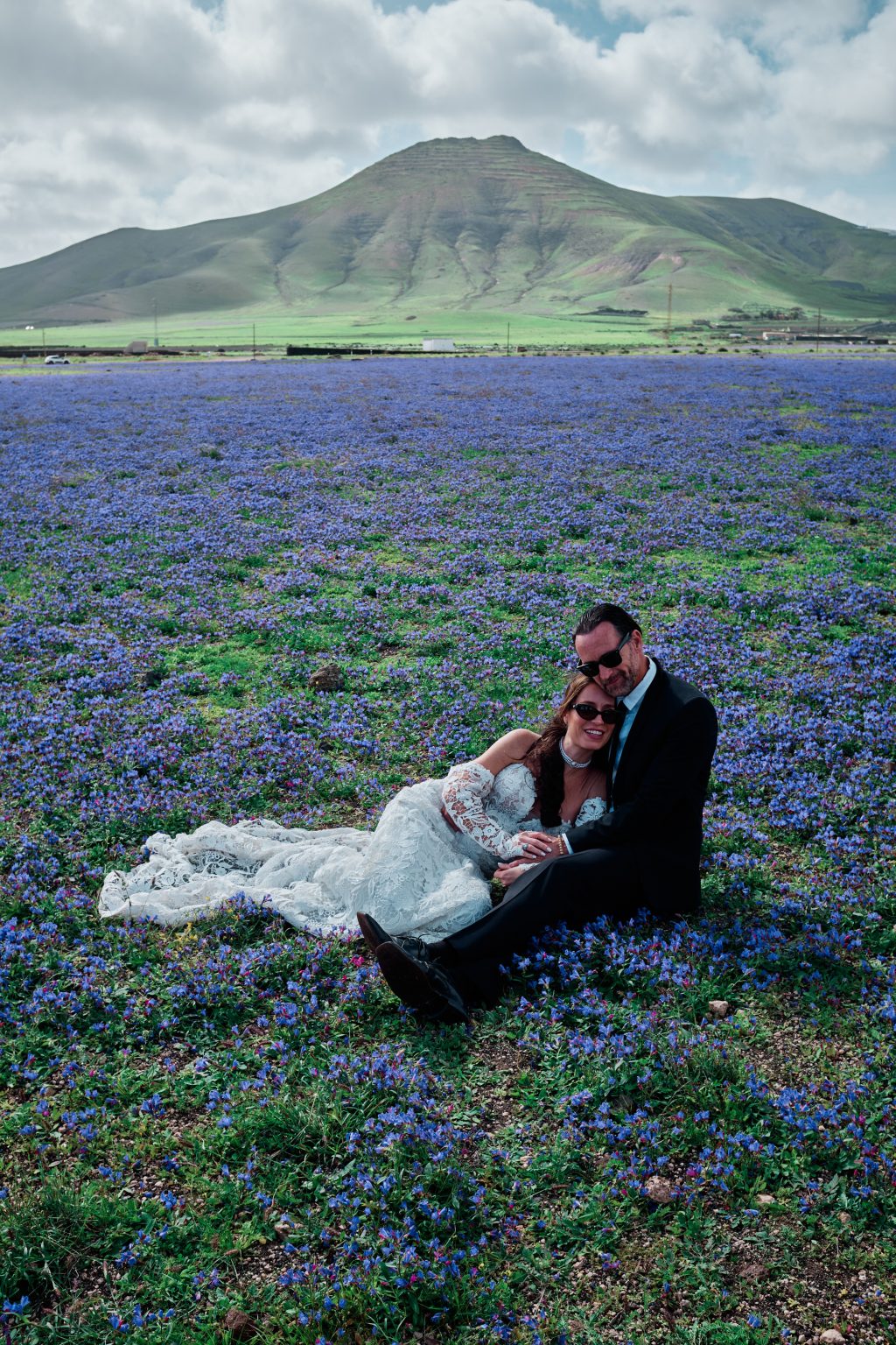 Juan and Laura in a purple meadow, Lanzarote wedding photographer