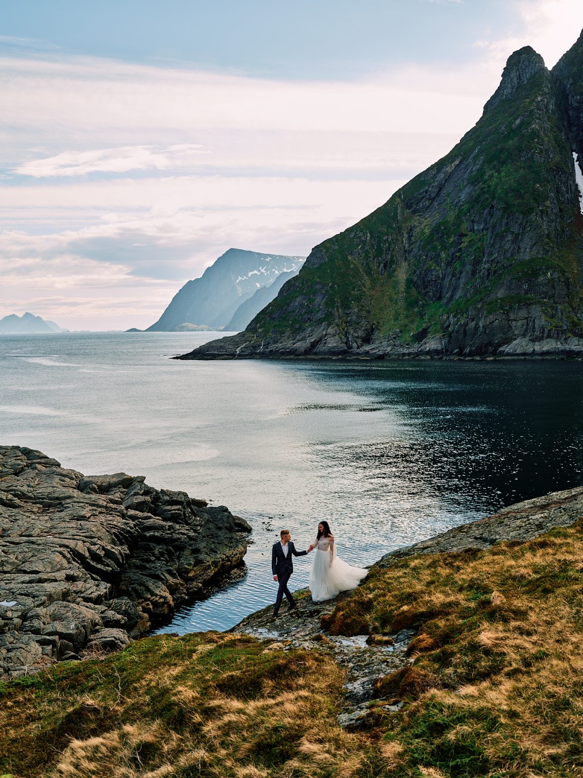 Sophie and Johan on a ledge above a Lofoten fjord