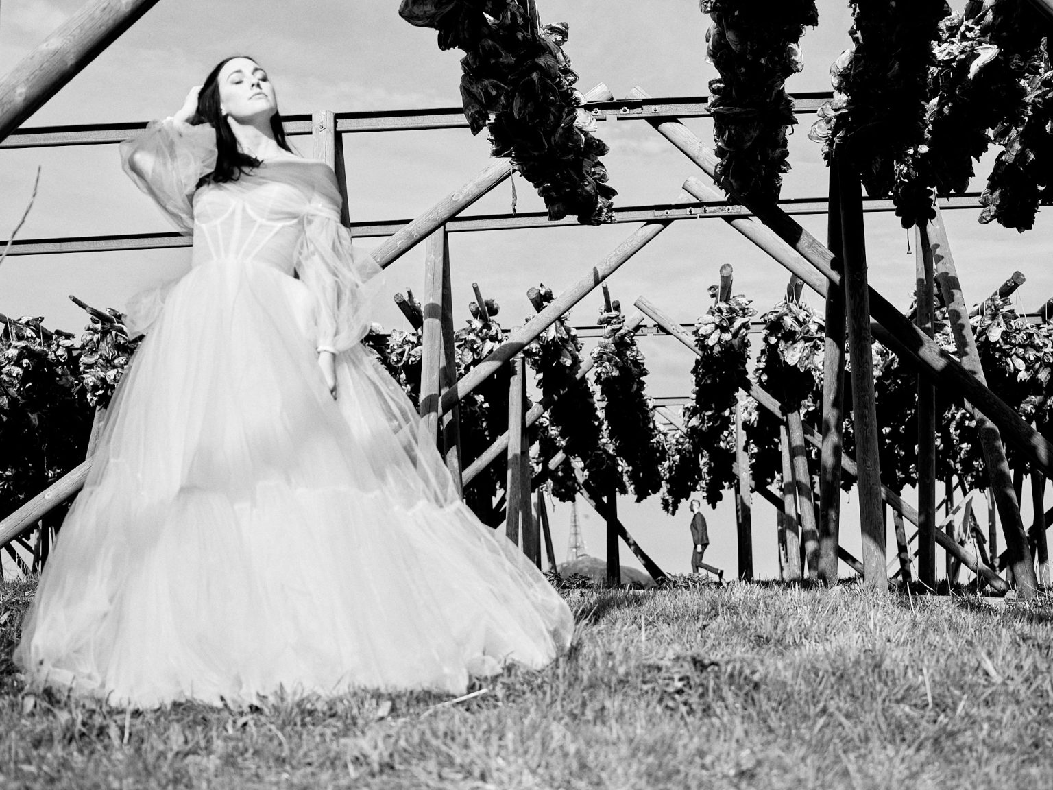 The bride among the cod-drying racks in Lofoten, black and white