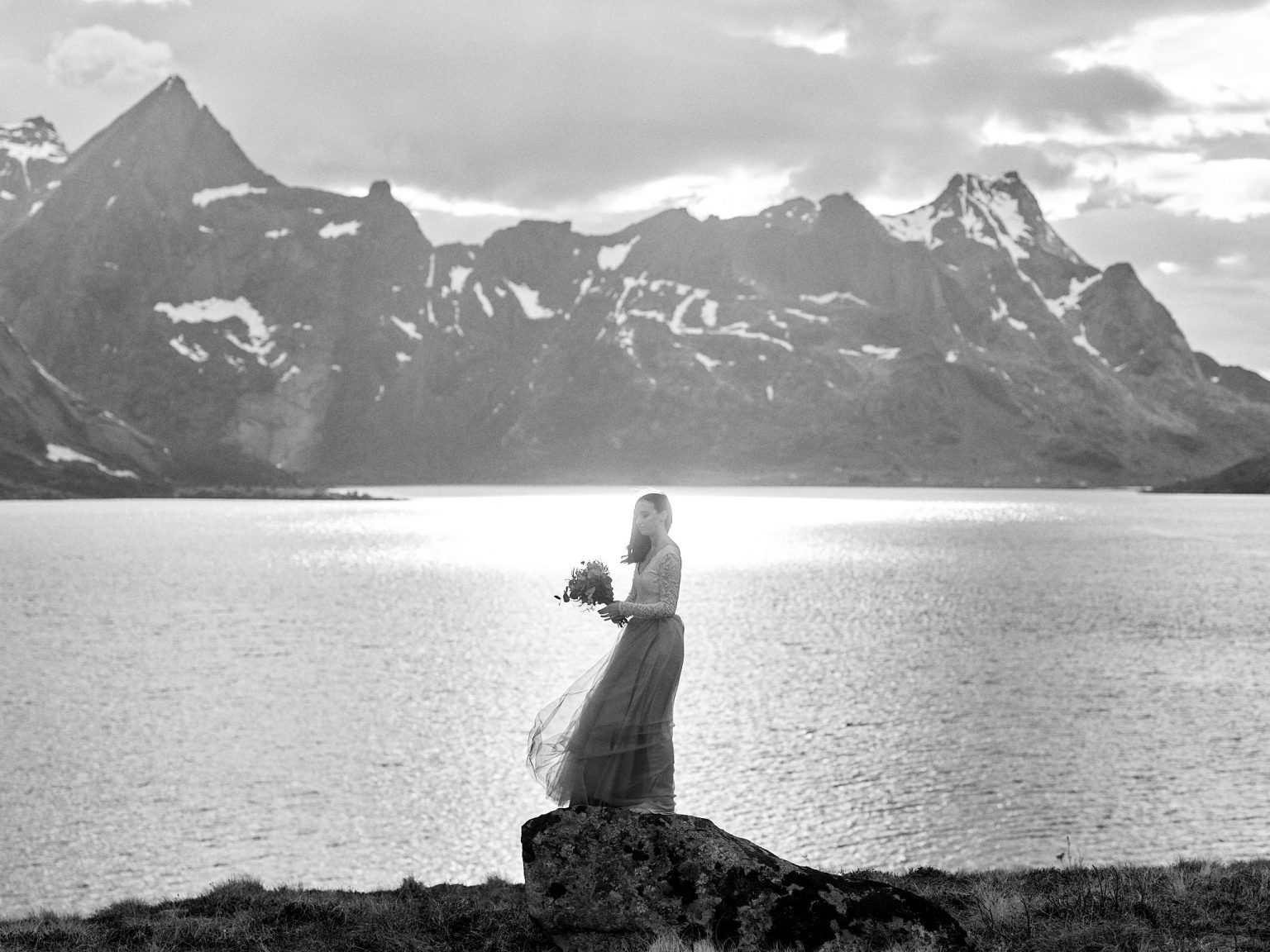 The bride by the fjord at sunset, Lofoten