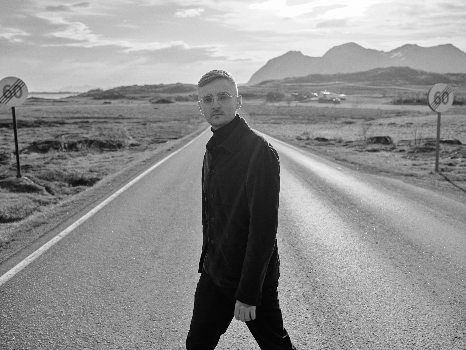 The groom on an empty Lofoten road, black and white
