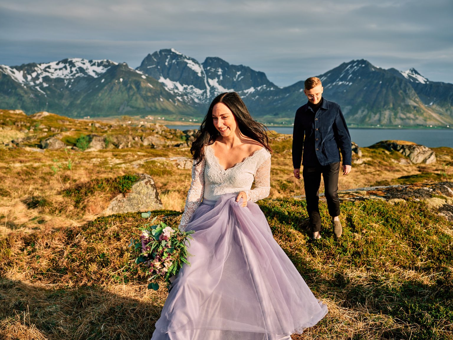 Sophie and Johan on a headland below the Lofoten peaks