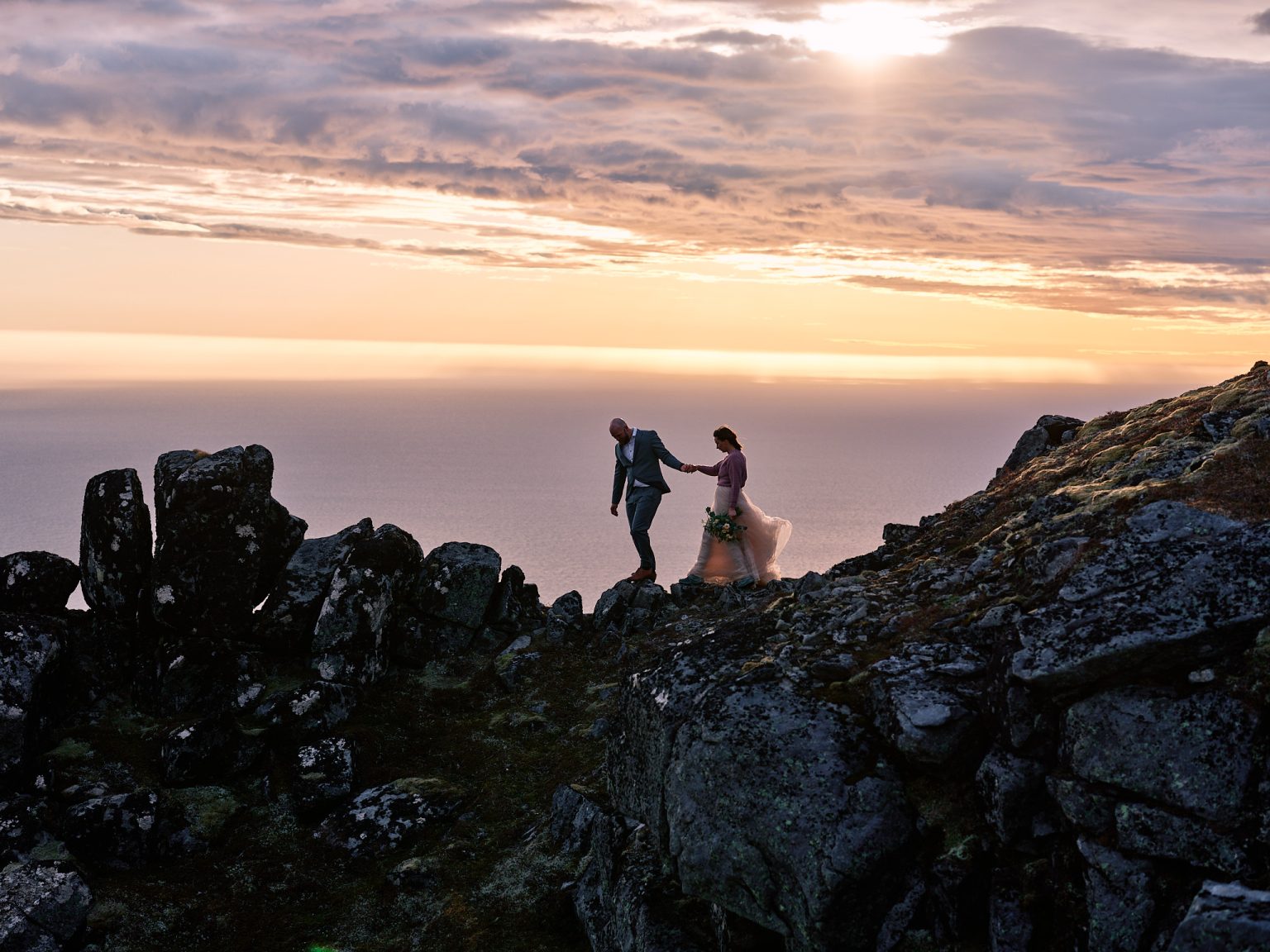 Sunset on the summit of Ryten, a Lofoten hiking elopement