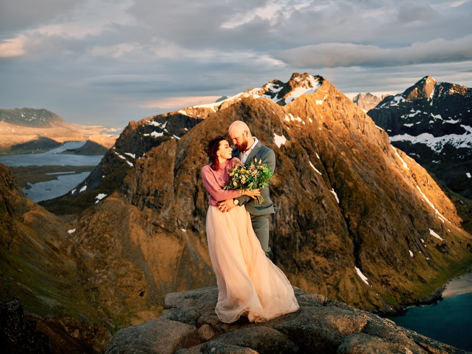 The couple close on the summit of Ryten, peaks behind