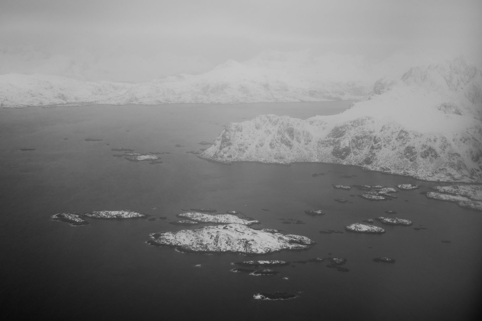 Moody grey fjord and snow, Lofoten in winter