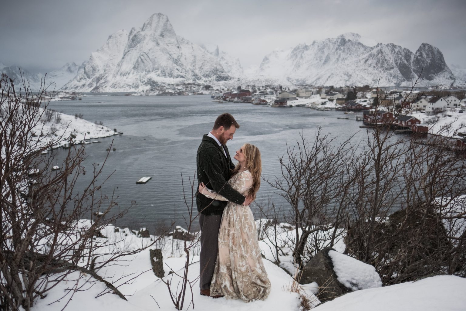 The couple by the water at Reine, Lofoten in winter