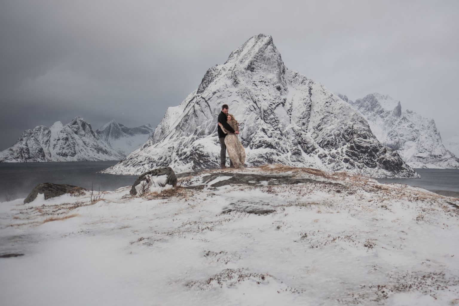 The sharp peak above Reine, the couple tiny below, Lofoten