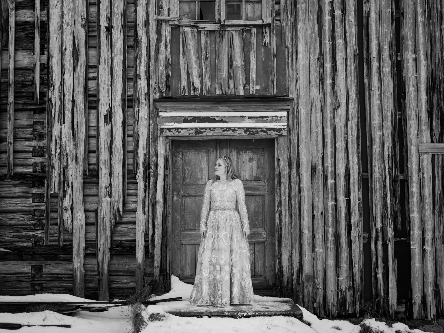 The bride against a wall of weathered wood, Lofoten, Norway